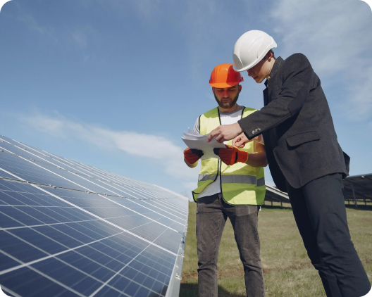 Solar employees discussing planing of solar farm